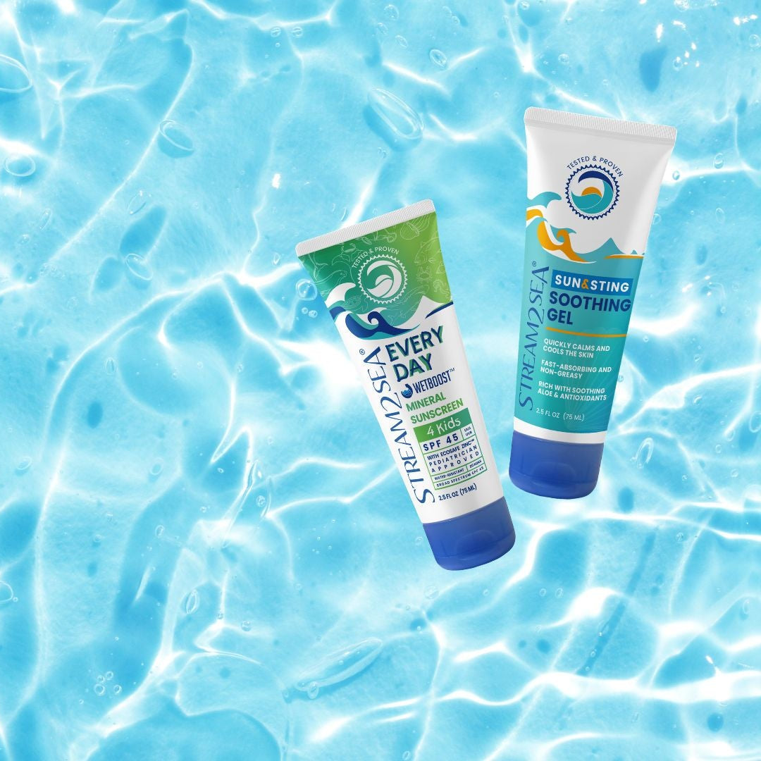Two sunscreen bottles on a blue water background